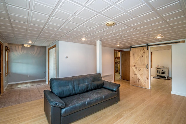 98 Rowell Rd, Lancaster, NH 03584 - living room featuring a barn door, light wood-style flooring, and recessed lighting