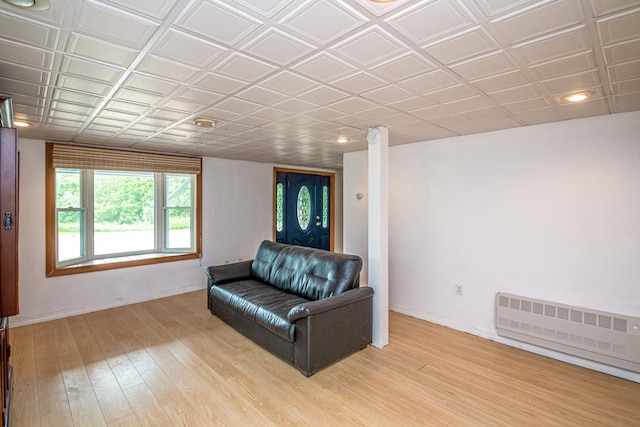 98 Rowell Rd, Lancaster, NH 03584 - living area with radiator heating unit and light wood finished floors
