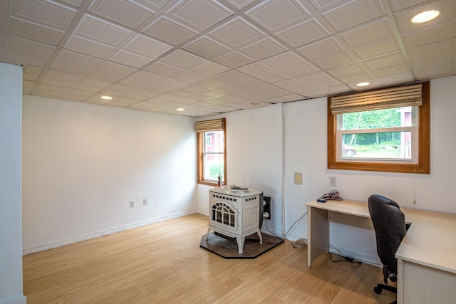 98 Rowell Rd, Lancaster, NH 03584 - home office featuring light wood-type flooring, healthy amount of natural light, a wood stove, and recessed lighting