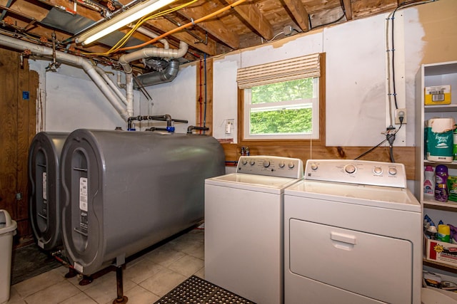 98 Rowell Rd, Lancaster, NH 03584 - laundry room with oil tank, washing machine and clothes dryer, and tile patterned floors