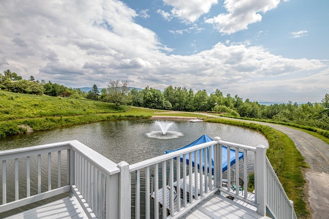 98 Rowell Rd, Lancaster, NH 03584 - wooden deck with a water view and view of wooded area