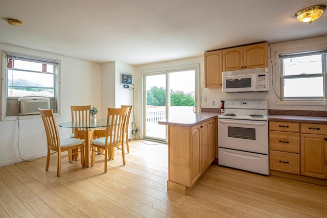 98 Rowell Rd, Lancaster, NH 03584 - kitchen featuring white appliances, a peninsula, light wood finished floors, and light brown cabinets