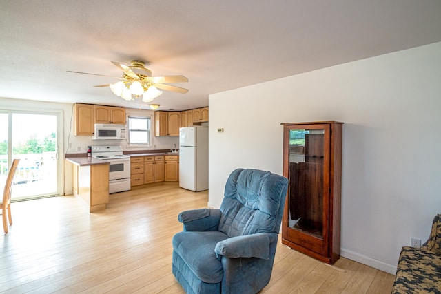 98 Rowell Rd, Lancaster, NH 03584 - kitchen featuring white appliances, open floor plan, light wood-style floors, a ceiling fan, and light brown cabinets