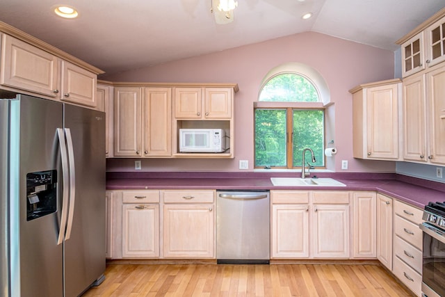 98 Rowell Rd, Lancaster, NH 03584 - kitchen featuring stainless steel appliances, vaulted ceiling, dark countertops, recessed lighting, and glass insert cabinets
