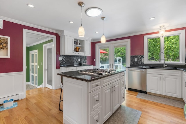 397 Strafford Rd, Strafford, NH 03844 - kitchen featuring appliances with stainless steel finishes, white cabinetry, light wood-style floors, ornamental molding, and wainscoting