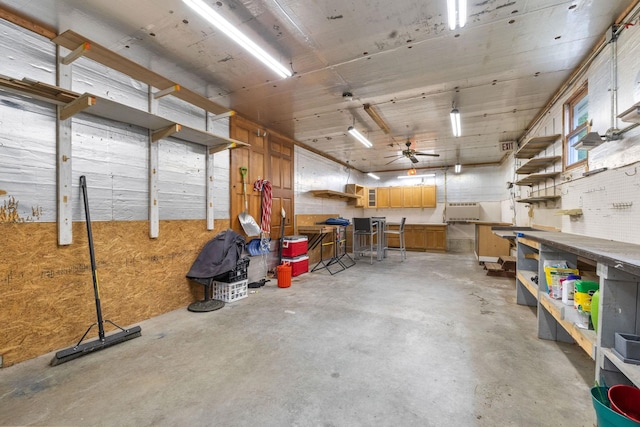 397 Strafford Rd, Strafford, NH 03844 - garage featuring a workshop area and a ceiling fan