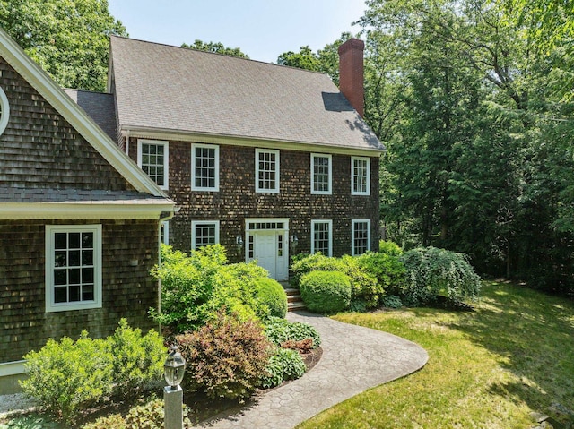 6 Walters Way, Exeter, NH 03833 - view of front of house featuring a chimney, a front lawn, and a shingled roof