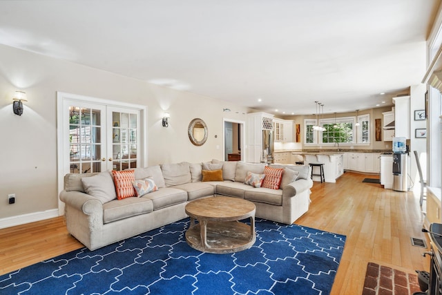 6 Walters Way, Exeter, NH 03833 - living room with light wood finished floors and french doors