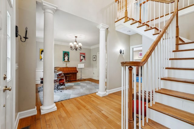 6 Walters Way, Exeter, NH 03833 - foyer entrance featuring ornamental molding, wood-type flooring, ornate columns, stairway, and a chandelier