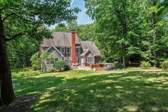 6 Walters Way, Exeter, NH 03833 - back of property with a lawn, a chimney, and a wooden deck