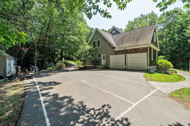 6 Walters Way, Exeter, NH 03833 - view of home's exterior with concrete driveway and roof with shingles
