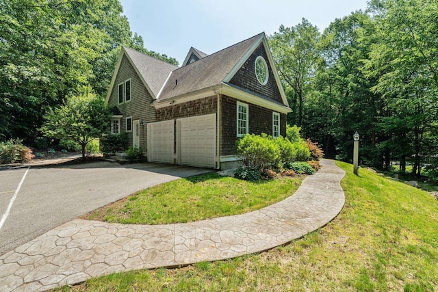 6 Walters Way, Exeter, NH 03833 - view of side of property featuring driveway, a lawn, roof with shingles, and an attached garage