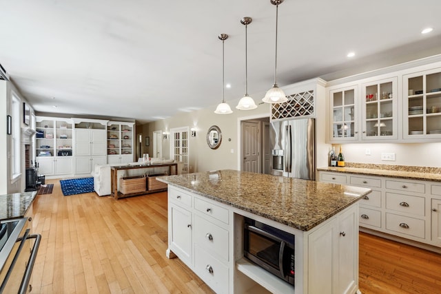 6 Walters Way, Exeter, NH 03833 - kitchen featuring stainless steel refrigerator with ice dispenser, range, light wood-type flooring, white cabinets, and recessed lighting