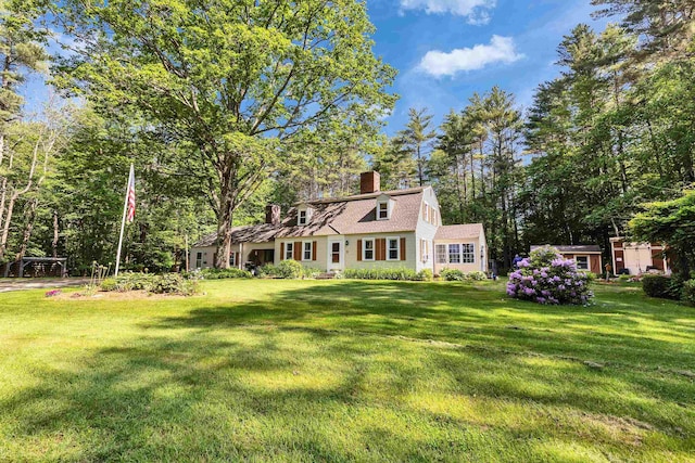 76 Cunningham Pond Rd, Peterborough, NH 03458 - view of front facade with a chimney, a gambrel roof, and a front lawn