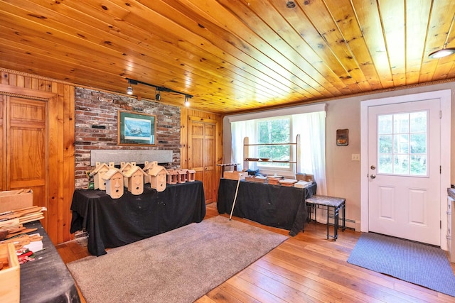 76 Cunningham Pond Rd, Peterborough, NH 03458 - entryway with track lighting, hardwood / wood-style flooring, wood ceiling, and wood walls