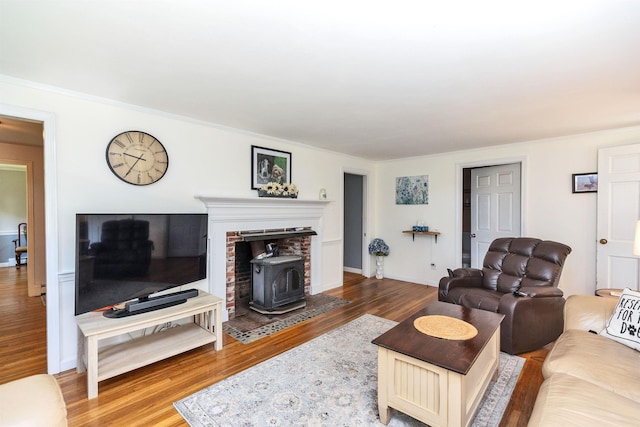 76 Cunningham Pond Rd, Peterborough, NH 03458 - living area with a wood stove and wood finished floors