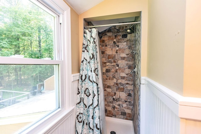 76 Cunningham Pond Rd, Peterborough, NH 03458 - bathroom featuring a shower stall, a wainscoted wall, and vaulted ceiling