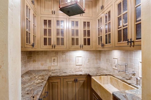 44 Buker Way, New London, NH 03257 - kitchen with tasteful backsplash, light stone counters, and glass insert cabinets