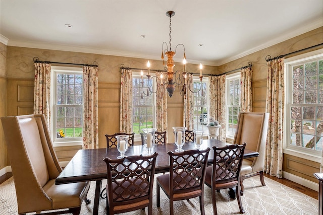 44 Buker Way, New London, NH 03257 - dining space featuring a chandelier, healthy amount of natural light, light wood-type flooring, a decorative wall, and crown molding
