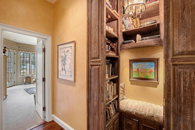 44 Buker Way, New London, NH 03257 - corridor featuring a chandelier and baseboards