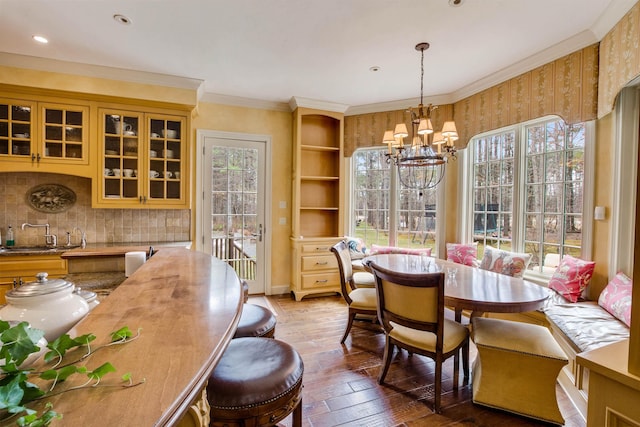 44 Buker Way, New London, NH 03257 - dining area with plenty of natural light, a chandelier, hardwood / wood-style flooring, and crown molding