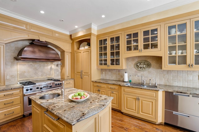 44 Buker Way, New London, NH 03257 - kitchen featuring custom exhaust hood, stainless steel appliances, decorative backsplash, a kitchen island with sink, and ornamental molding