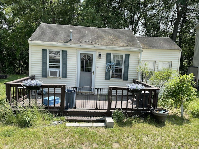 144 Lake St Unit 19, Laconia, NH 03246 - rear view of property featuring a deck, cooling unit, and a shingled roof