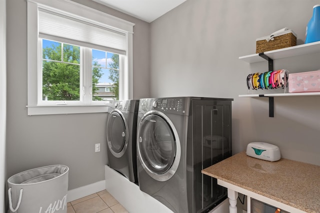 74 Childs Dr, Dover, NH 03820 - laundry room featuring washing machine and dryer and light tile patterned floors