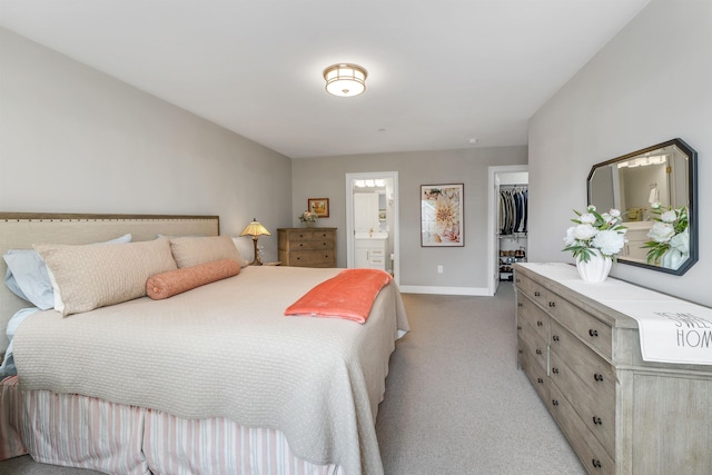 61 Acadia Ln Unit 309, Exeter, NH 03833 - bedroom featuring light carpet, a spacious closet, ensuite bath, and a closet