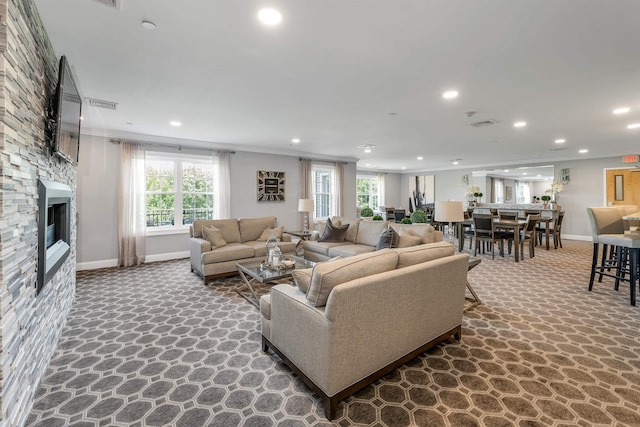 61 Acadia Ln Unit 309, Exeter, NH 03833 - living room featuring recessed lighting, a stone fireplace, and ornamental molding