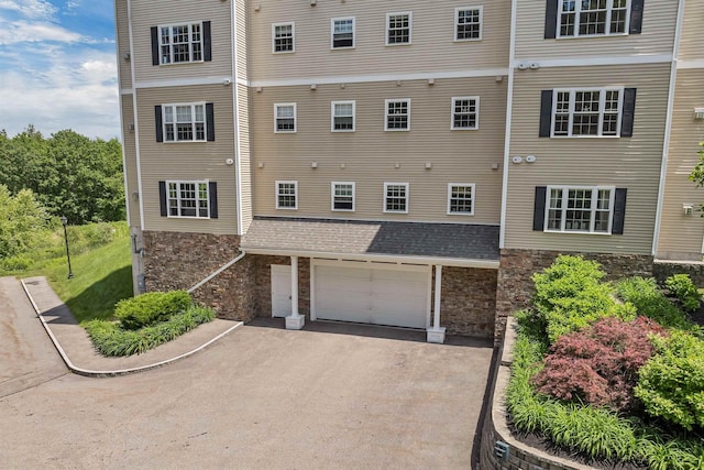 61 Acadia Ln Unit 309, Exeter, NH 03833 - view of property with a garage and driveway