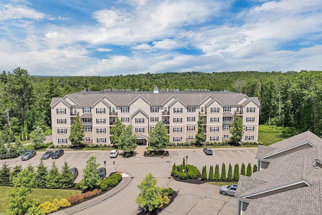 61 Acadia Ln Unit 309, Exeter, NH 03833 - drone / aerial view of a heavily wooded area and apartment complex