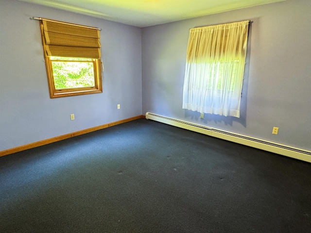 257 Crane St, Littleton, NH 03561 - carpeted empty room with a baseboard heating unit and baseboards