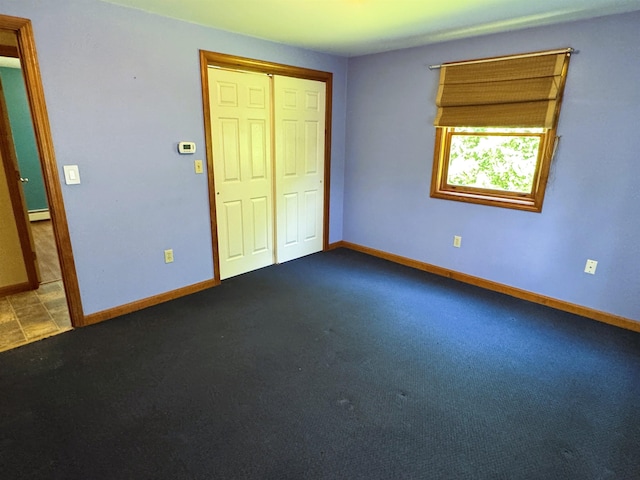 257 Crane St, Littleton, NH 03561 - unfurnished bedroom with carpet flooring, a closet, and baseboard heating