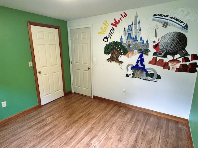 257 Crane St, Littleton, NH 03561 - unfurnished room with wood finished floors and baseboards