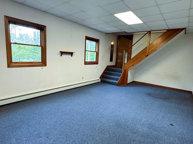 257 Crane St, Littleton, NH 03561 - unfurnished living room featuring stairway, a baseboard radiator, a drop ceiling, and carpet floors