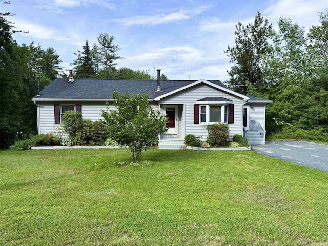 257 Crane St, Littleton, NH 03561 - view of front of property featuring a front yard, driveway, and roof with shingles