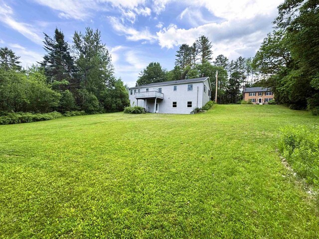 257 Crane St, Littleton, NH 03561 - view of grassy yard with a wooden deck
