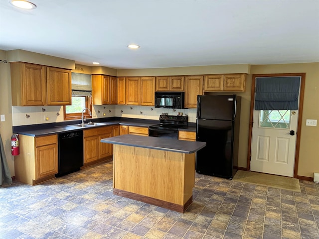 257 Crane St, Littleton, NH 03561 - kitchen with black appliances, dark countertops, tasteful backsplash, a center island, and recessed lighting