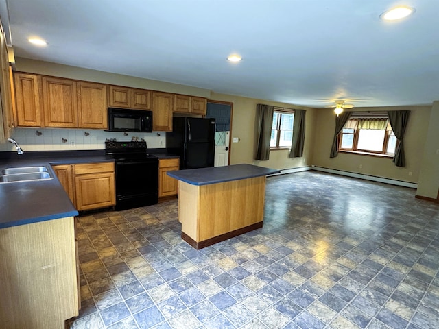 257 Crane St, Littleton, NH 03561 - kitchen with black appliances, dark countertops, a center island, stone finish flooring, and recessed lighting
