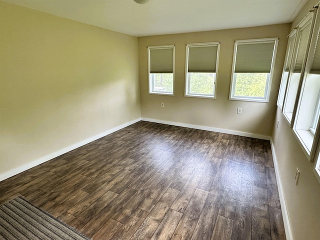 257 Crane St, Littleton, NH 03561 - empty room with plenty of natural light and dark wood finished floors