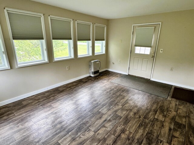 257 Crane St, Littleton, NH 03561 - empty room featuring dark wood-style flooring and baseboards