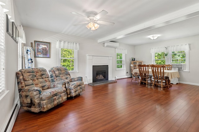 11 Parkside Dr, Pelham, NH 03076 - living area with baseboard heating, a wall mounted AC, plenty of natural light, a ceiling fan, and beamed ceiling