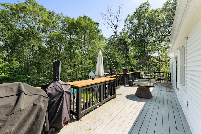11 Parkside Dr, Pelham, NH 03076 - wooden deck with outdoor dining space and area for grilling
