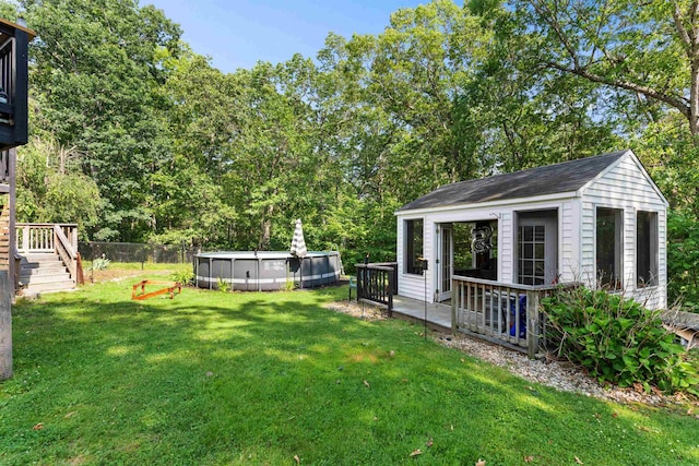 11 Parkside Dr, Pelham, NH 03076 - view of yard with an outdoor pool, a deck, stairs, and an outbuilding