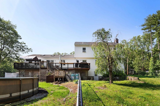 11 Parkside Dr, Pelham, NH 03076 - back of house with a deck, stairs, a yard, a chimney, and an outdoor pool