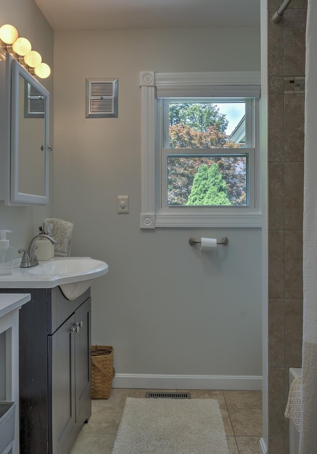 67 Pine Ave, Keene, NH 03431 - full bathroom featuring vanity, tile patterned floors, and a shower