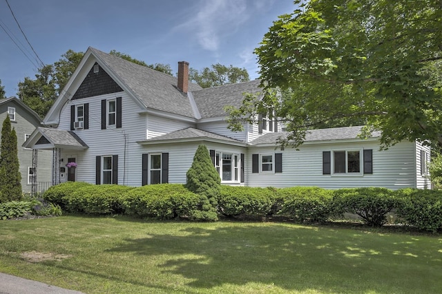 67 Pine Ave, Keene, NH 03431 - view of front of house featuring a front yard and a chimney