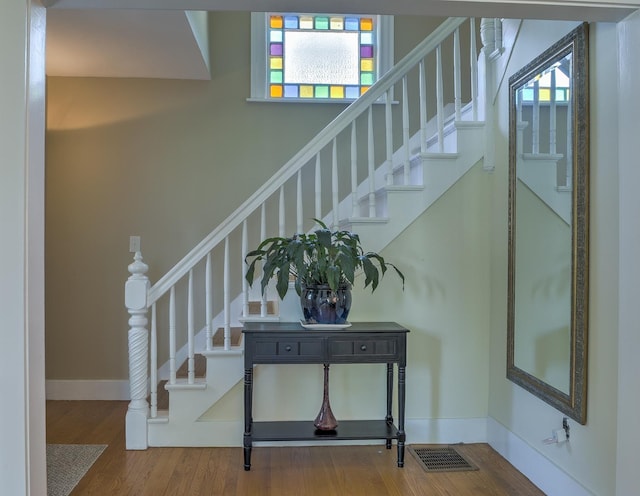 67 Pine Ave, Keene, NH 03431 - stairs featuring healthy amount of natural light and wood finished floors