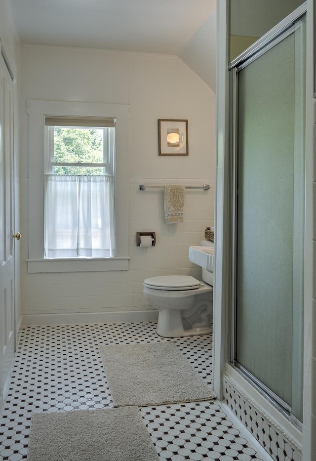 67 Pine Ave, Keene, NH 03431 - bathroom featuring a stall shower, vaulted ceiling, and tile patterned floors